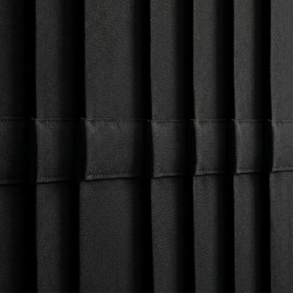Intelligent overlapping design of dense vertical slats ensuring minimal edge light bleed.