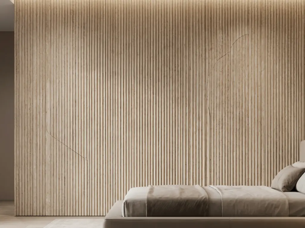 Elegant stone cladding feature wall in a bedroom renovation Dubai